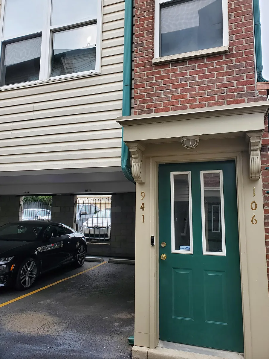 One parking space next to the front door , second parking space on the back side of unit non gated (security camera) - 941 Baxter Ave #106