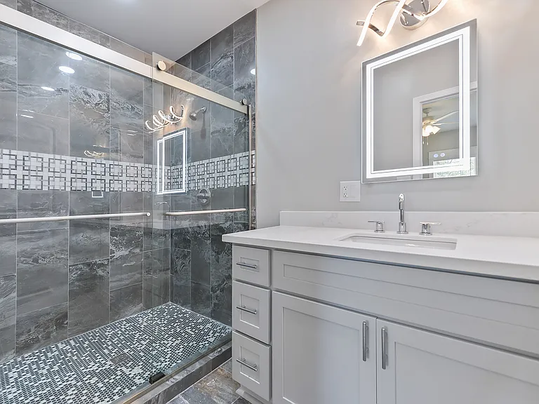 Main large shower with sink and large countertop