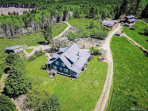 With Weyerhaeuser land on all sides privacy abounds in this lovingly built custom farmhouse which is right out of a fairy tale. 