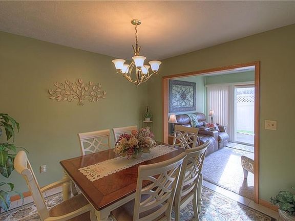 Dining Room. Well lit and sufficiently sized, the dining room allows easy flow into the Den on the right and just a few steps to