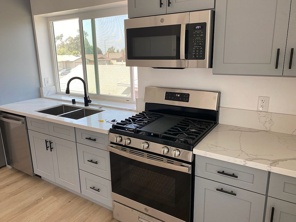 microwave, 5 burner stove, oven, sink