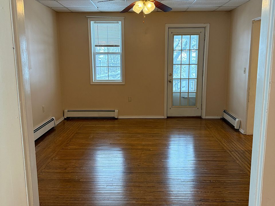 Living room or family room with door to private balcony