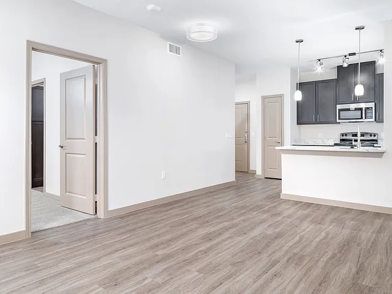 Hardwood Floors and Carpeted Bedrooms