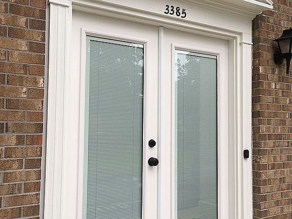 French doors with blinds.

