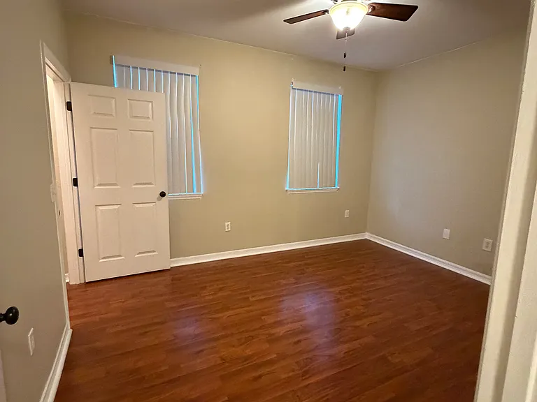 Room 3: Spacious bedroom with convenient closet space.