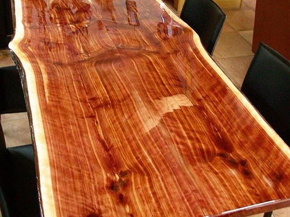 Owner-built Arkansas Cedar Live edge dining table (seats 8) and matches the kitchen bar, and the stair railing.
