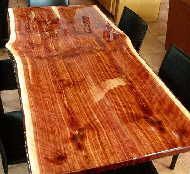 Owner-built Arkansas Cedar Live edge dining table (seats 8) and matches the kitchen bar, and the stair railing.