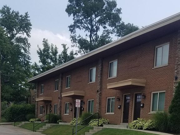 Exterior of building has night lights and security cameras