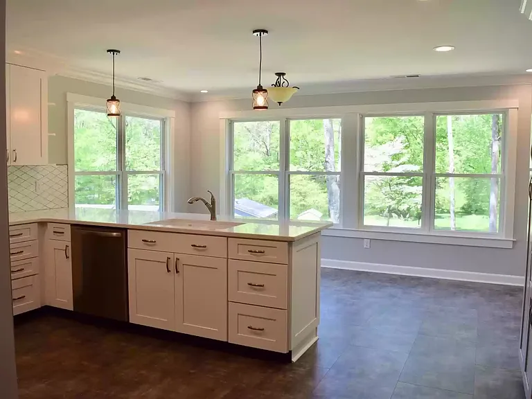 Perfect place for a kitchen table & chairs to enjoy your morning coffee and look out to the tree lined backyard.