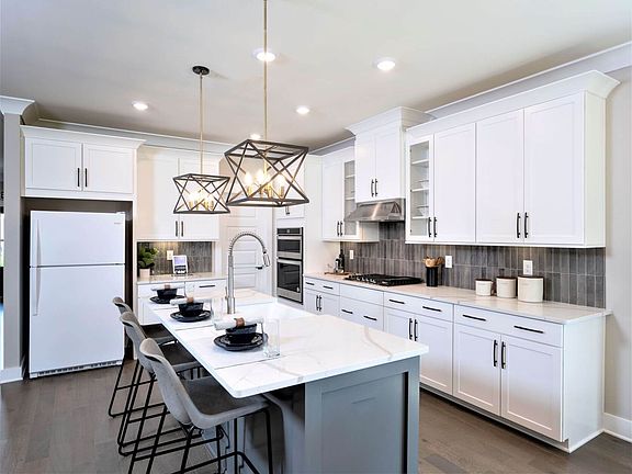 Gather the family around the kitchen island while cooking dinners.