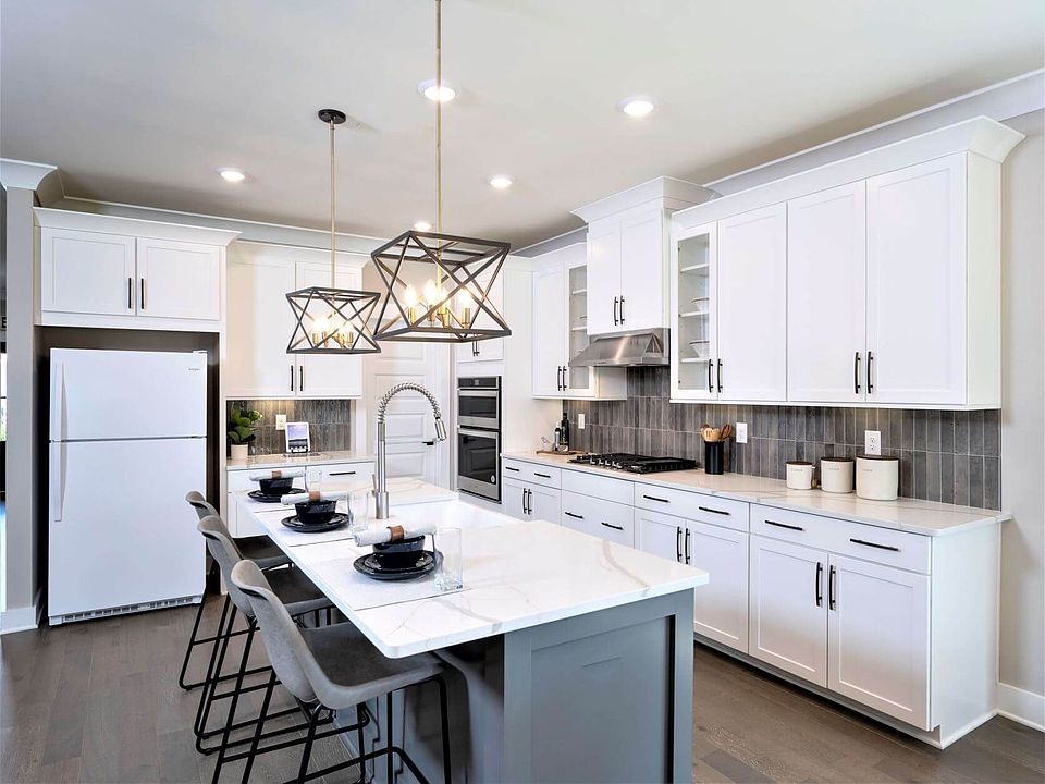Gather the family around the kitchen island while cooking dinners.