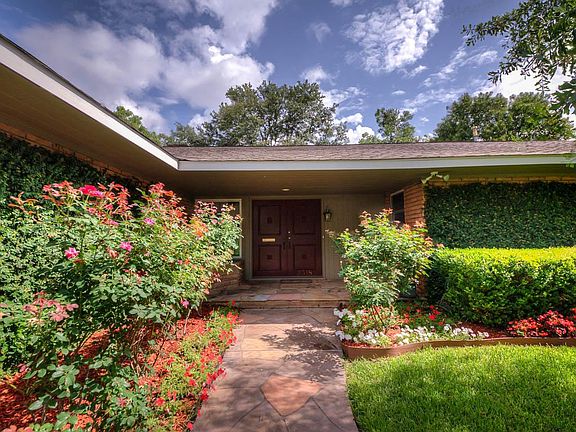 Front entrance with beautiful landscaping.