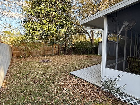 Fenced backyard, covered/screened deck, storage shed