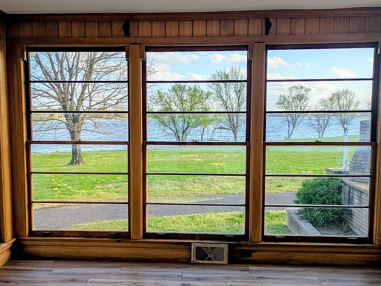 The sunroom is located off the dining room. The views are light are fantastic! 10x10.