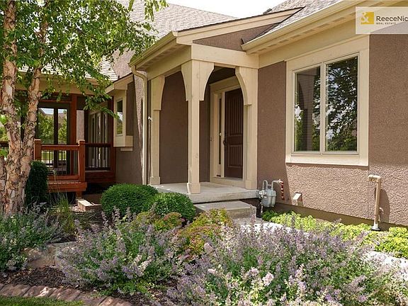 Front entry walk with beautiful landscape.