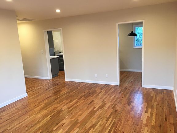living room facing kitchen and dinning area