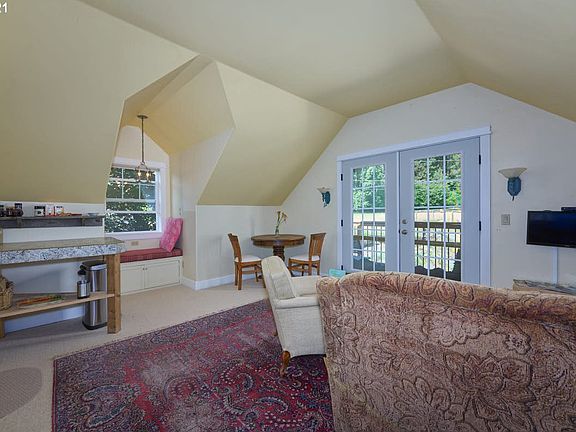 Living area when previously occupied. Notice the second seating area. Unit is unfurnished and has new flooring (see previous photo).