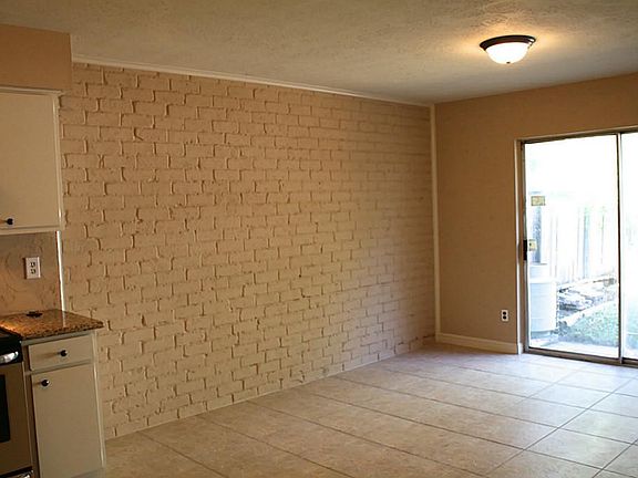 One view of the eating area next to the kitchen.  Sliding doors to exit to the back patio.