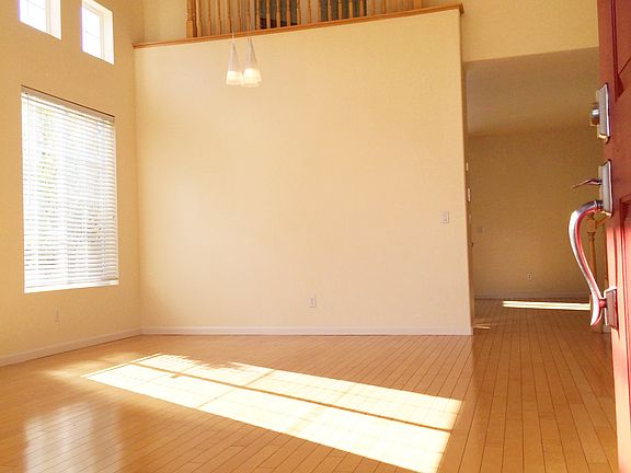 The Juliet balcony looks over the formal dining and living a