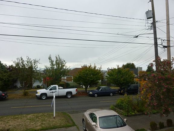 IT HAS A VIEW !!!! At this price point, it is usually not going to have a view, but looking east from the living room window, you'll see the tops of the Cascade Mountain range, a peek view of Mt. Rainier and the top of the downtown Seattle skyscrapers are visable in the distance.