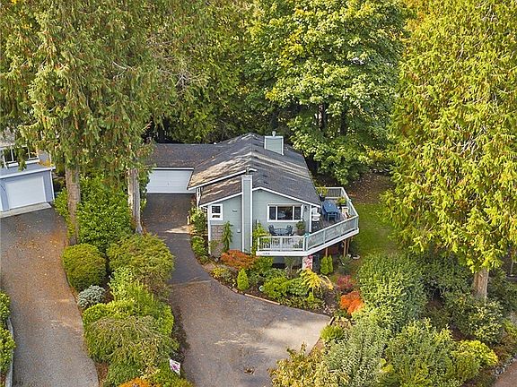 The home's location enjoys quiet privacy which is enhanced by the large pie shaped lot.