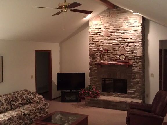 Stone fireplace and handhewn Cherry mantle accent the Great Room beautifully
