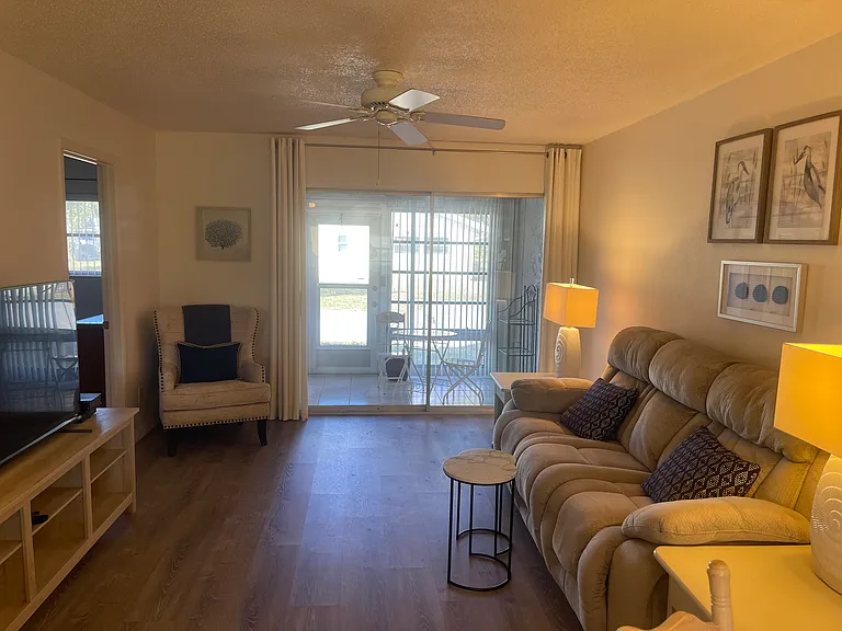 This view is from the Dining room. The gray sofa has been changed out for a green sofa. Photo coming soon.