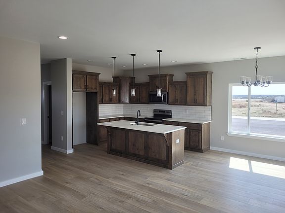 Inside corner of kitchen showing off the island