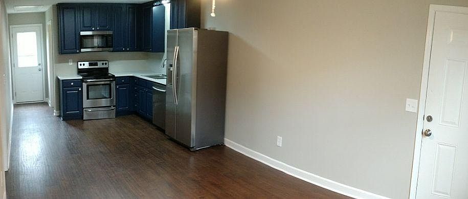 Wide angle shot of the kitchen and living room. Again, it's bigger in real life.