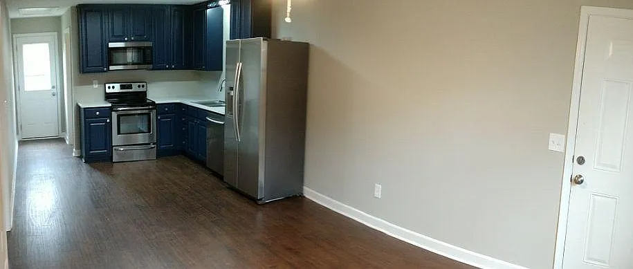 Wide angle shot of the kitchen and living room. Again, it's bigger in real life.