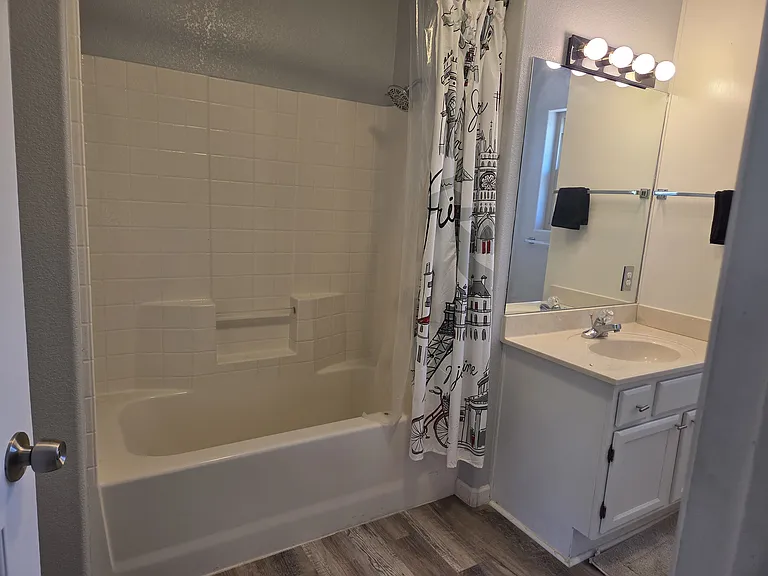 Second full size bathroom, shower/tub combo and sink.