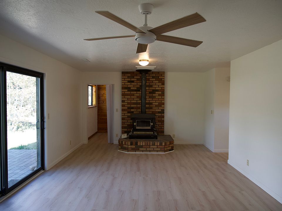 Living Room - wood-burning stove, new LVP flooring