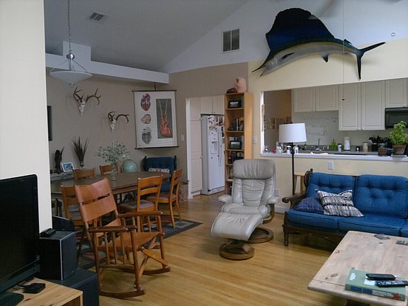 Living - Dining - view into kitchen - fish not included - hardwood floor - google fiber, at&t fiber, and comcast high speed internet available.
