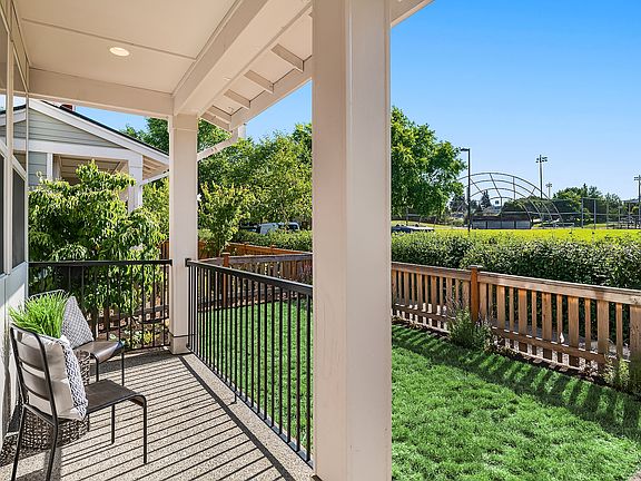 Overlooking Walt Hundley Park, walk just steps to new playgrounds, baseball and a soccer field!