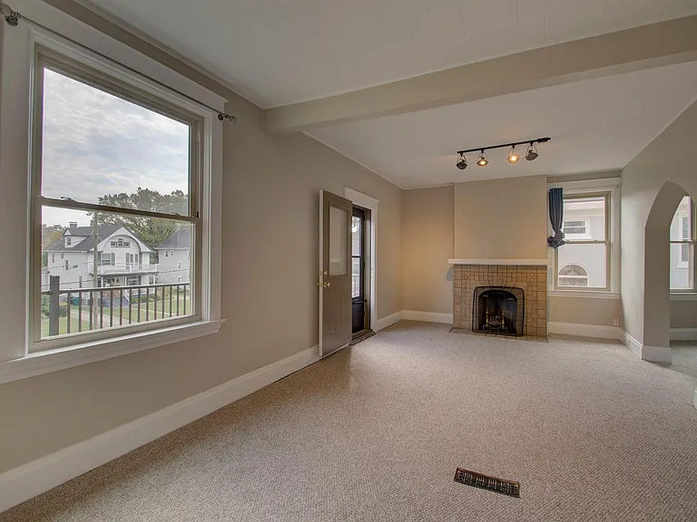 Living room has a private front porch
