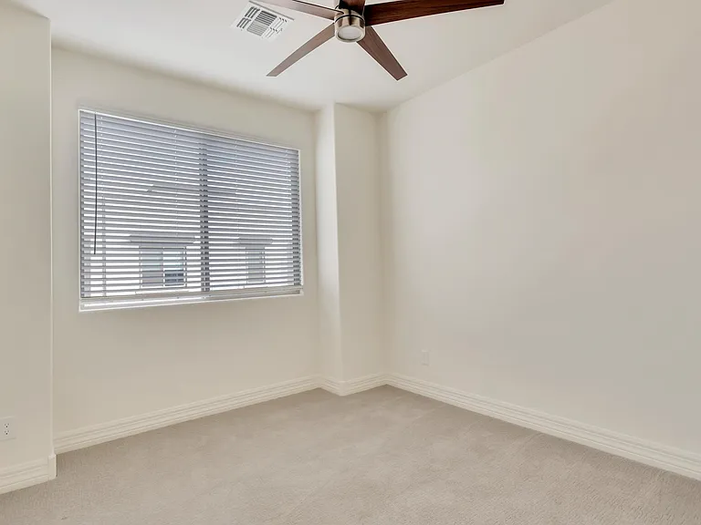 Third bedroom has same fan and window treatment as other 2 bedrooms.