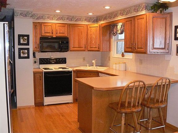 kitchen with oak cabinets and floor