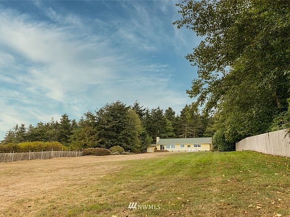 View of the home from the bluff this back yard is full fenced and ready for gardens or yard games.