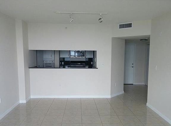 condo entry & kitchen