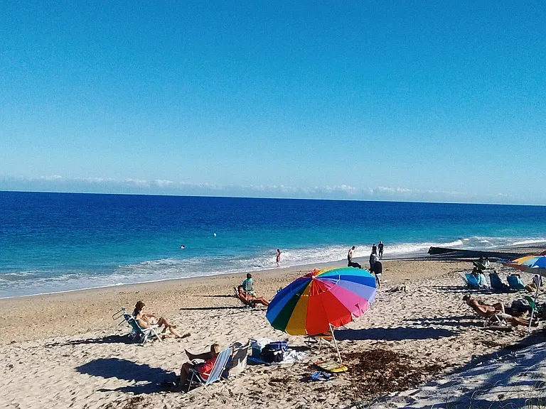 Walk across A1A to private beach 10 minutes. Also,Many public access in 5 minutes or less.