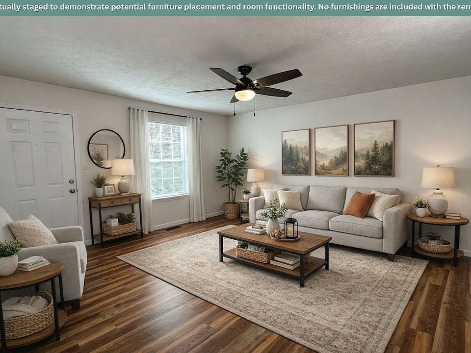 The living room is shown virtually staged to illustrate how the space can be comfortably furnished.