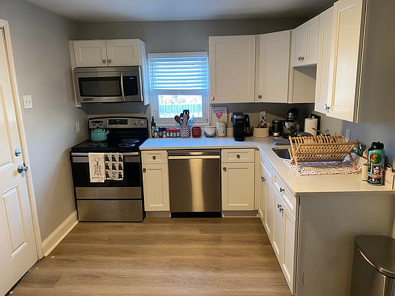 Brand new kitchen with custom cabinets, quarts countertops and stainless steel appliances