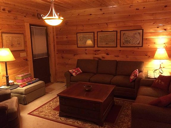 Cozy family room with fireplace overlooking lake