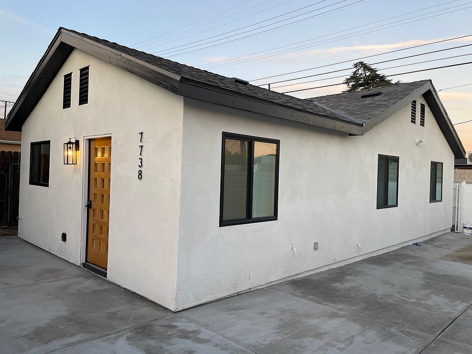 brand new construction with hardscape all around