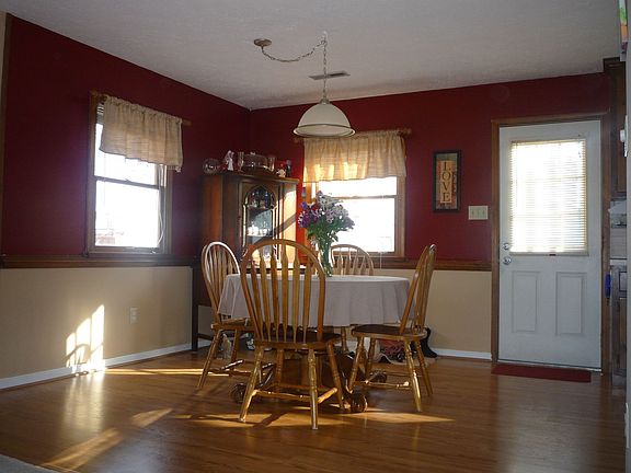 Dining area with new laminate flooring and light fixture