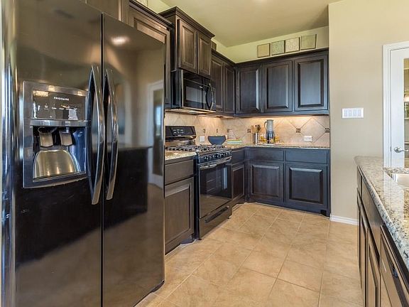 Drawings, pictures, photographs, videos, square footages, floor plans, elevations, features, colors and sizes are for illustration purposes only and will vary from the homes as built. Landscaping and furnishings may be decorator items that are not included in the purchase price and may not be available.