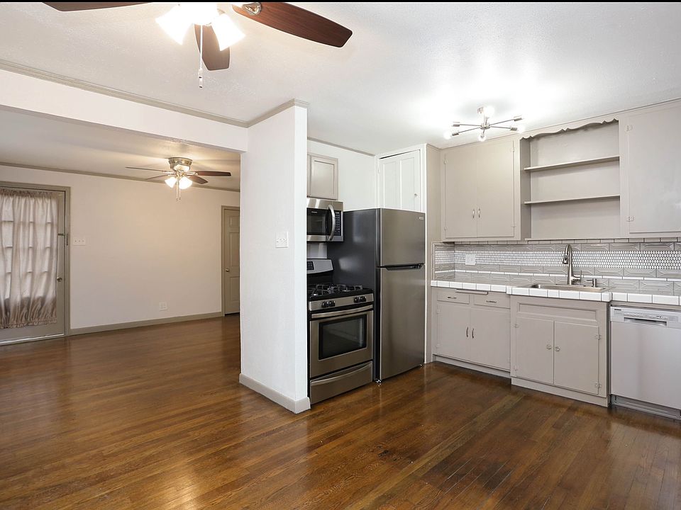 view from dining area into the kitchen and Living room