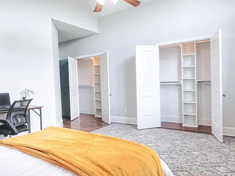 Bedroom showing 2 closets side by side.