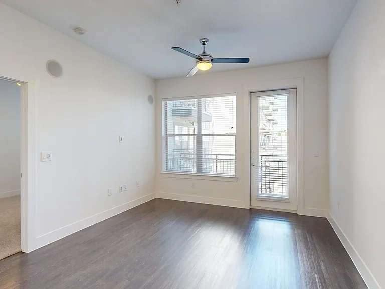 Apartment living room with wood-style flooring.