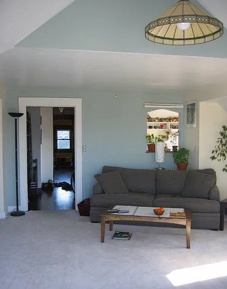 Living Room looking into kitchen and down hallway